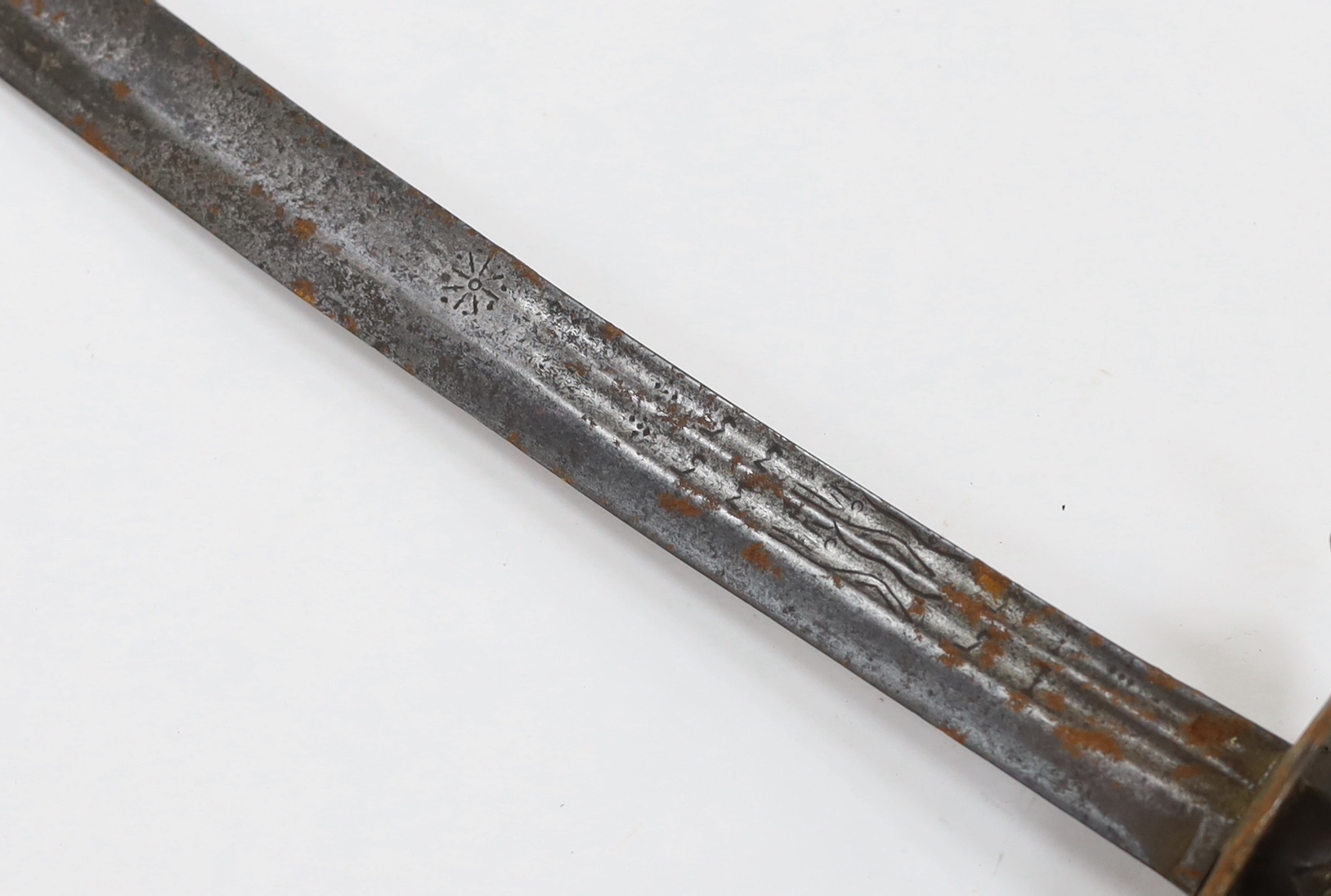 An English hangar, mid 17th century, curved fullered blade engraved with spurious date 1535 and running wolf mark, iron guard slightly reduced and swollen pommel, spirally carved and chequered bone grip, blade 67.5cm